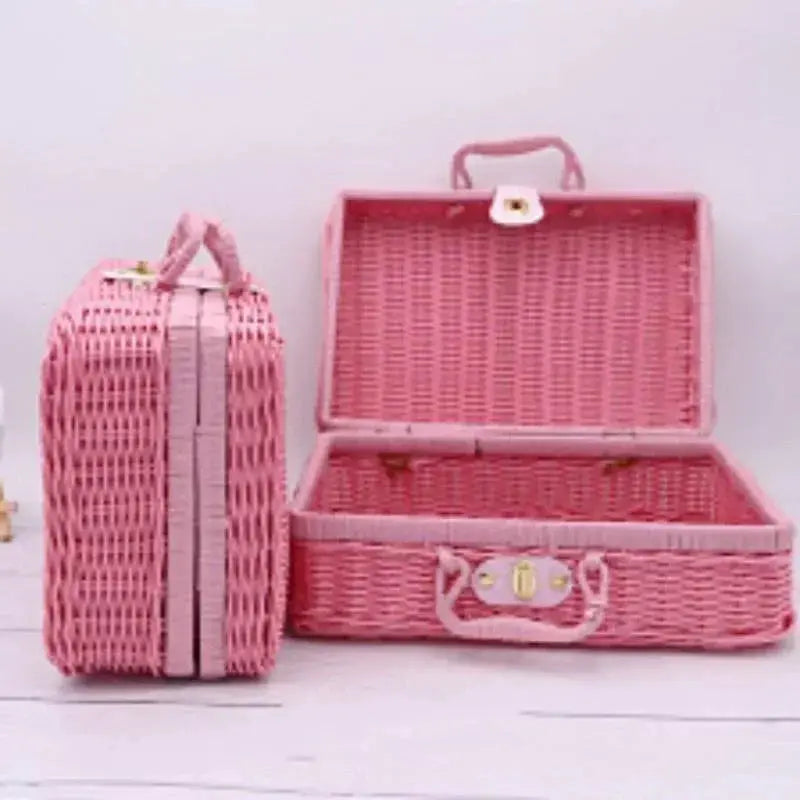 Rattan-style storage boxes set in pink; two woven boxes with handles by Simples Market.