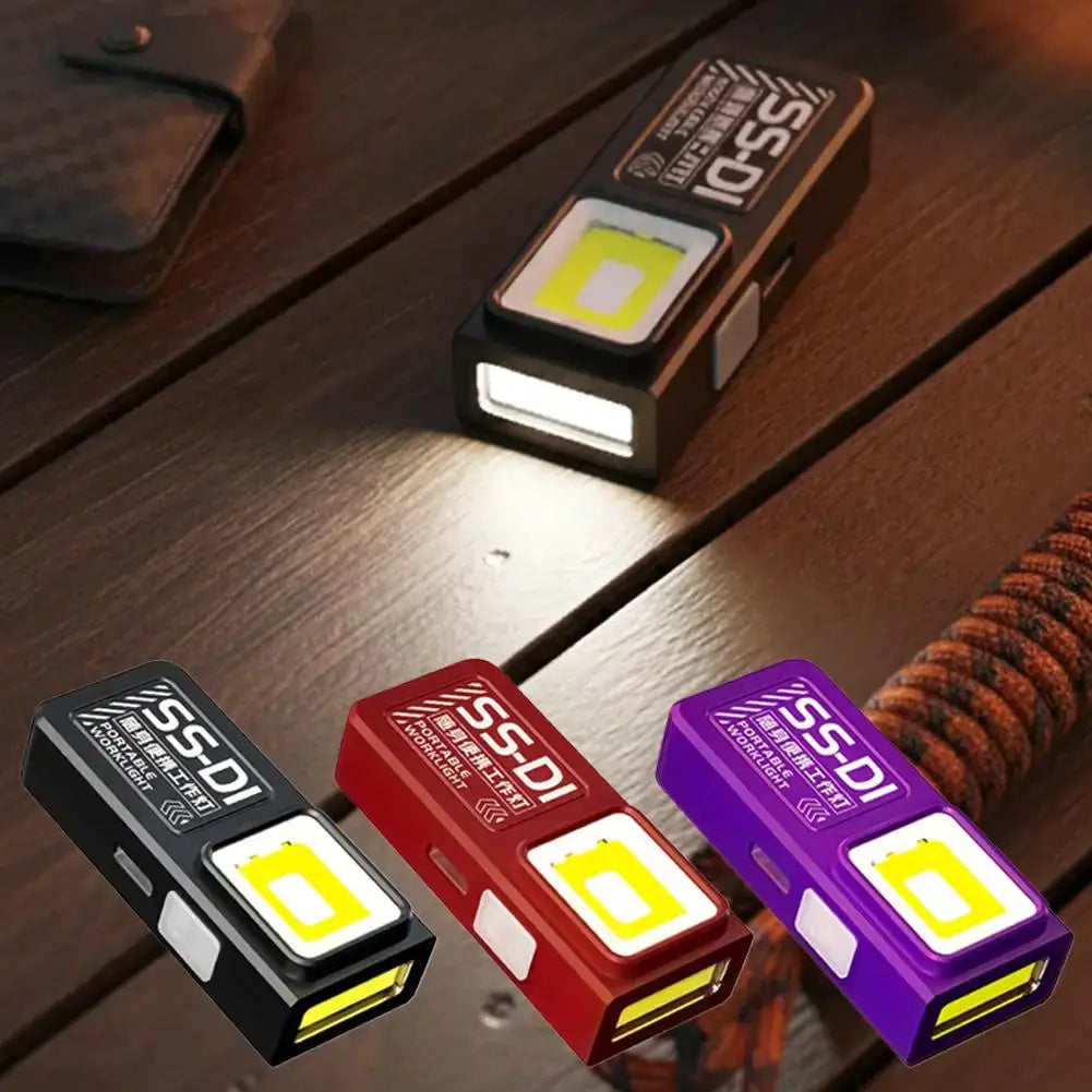 Simples Market mini COB LED keychain flashlight; USB-C rechargeable pocket light, 3 pieces in black, red and purple.