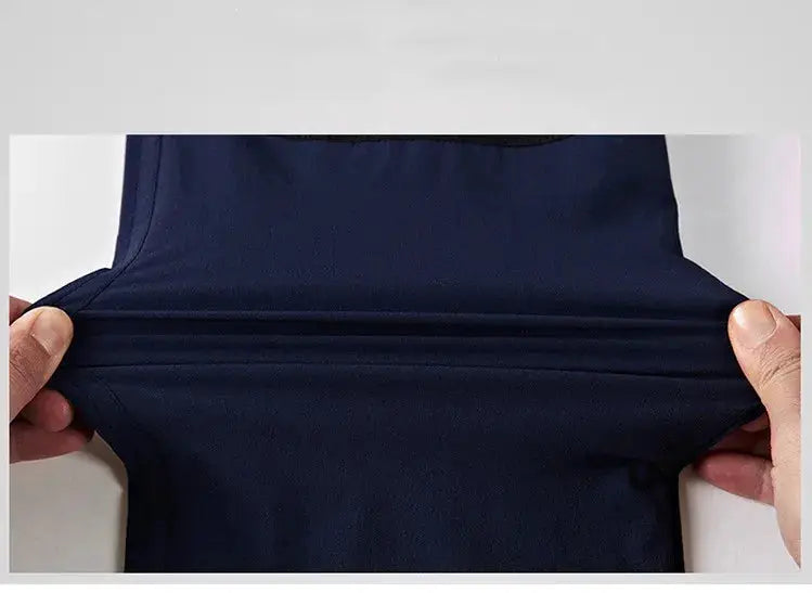 Tactical cargo pants navy stretch fabric being pulled to show elasticity