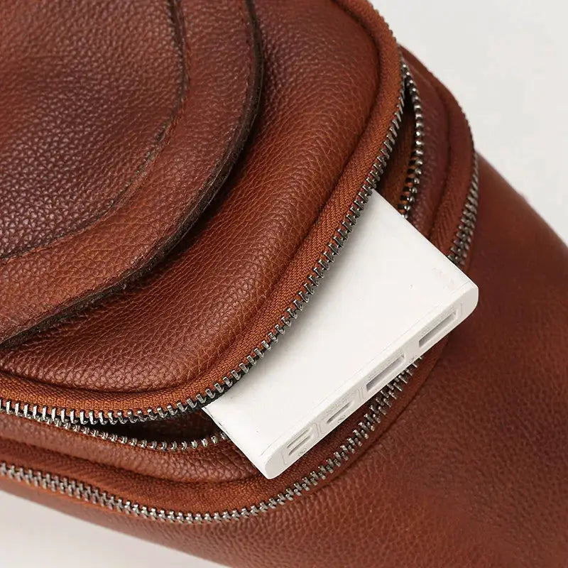Brown genuine top-grain leather chest bag for men; casual crossbody with large capacity.