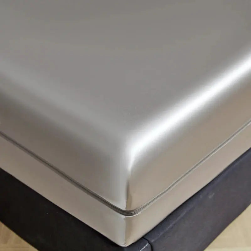 Mattress encasement with six-sided zipper in gray satin, full-size all-around cooling protector.