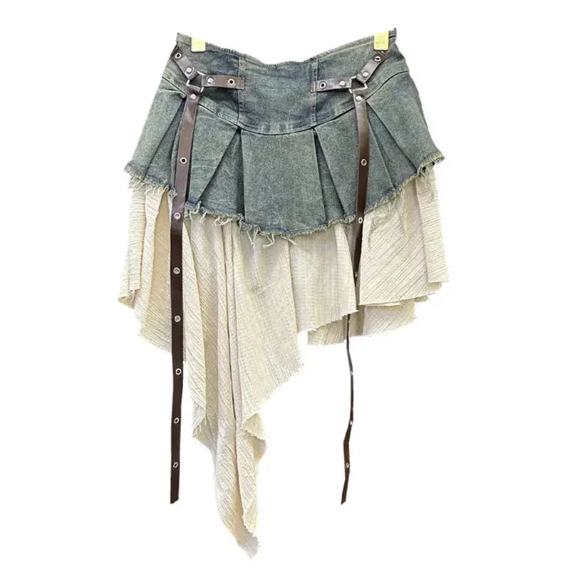 Short skirt with pleated denim overlay and asymmetric beige fabric panels, brown leather straps
