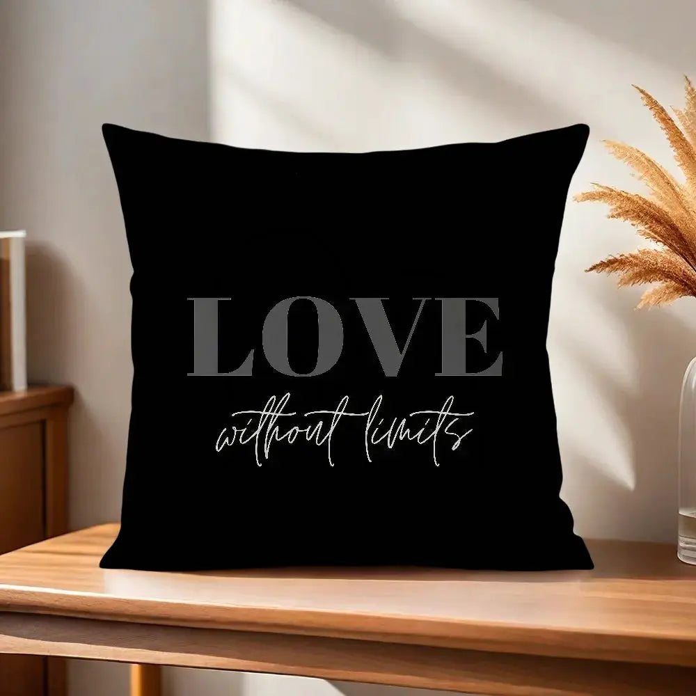 Simples Market decorative pillow cover; black cushion with large gray LOVE and white cursive without limits text