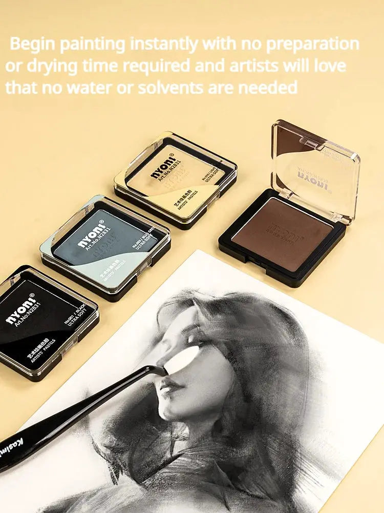 Pastel, graphite and charcoal drawing powders set in five tins with blendable pigments beside a charcoal portrait.