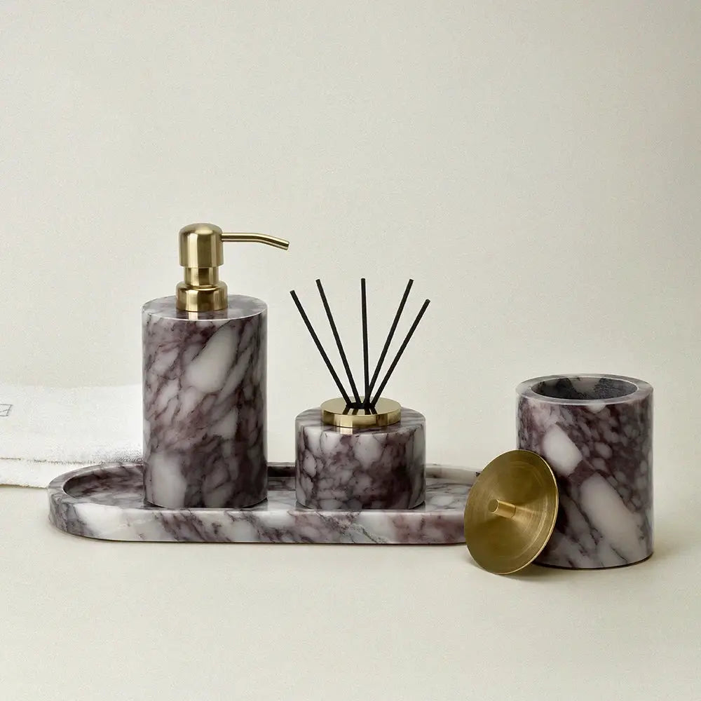 Calacatta Viola violet marble bathroom set by Simples Market; 4-piece with gold-tone pump, diffuser, cotton-swab jar.