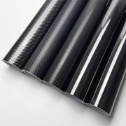 Black carbon fiber vinyl wrap rolls; automotive and motorcycle styling, air-release channels, multiple rolls
