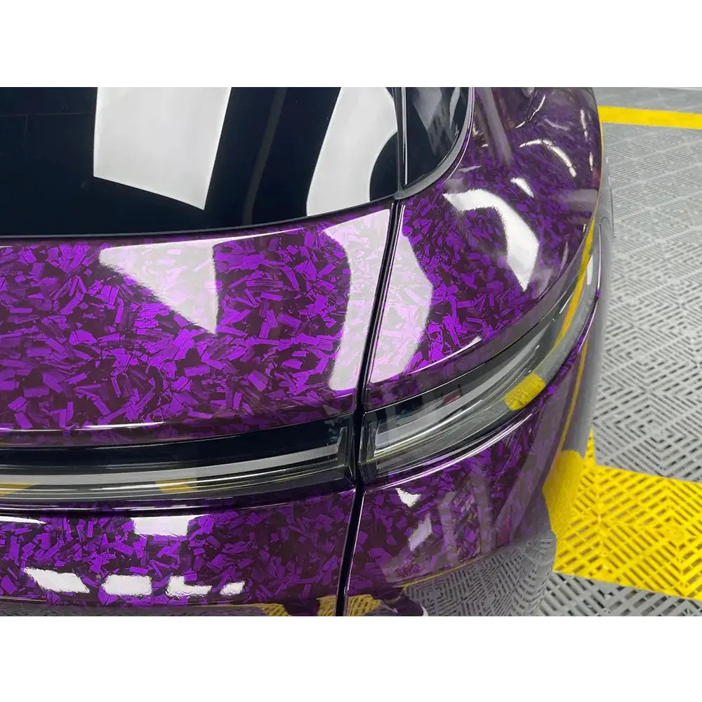 Car vinyl wrap by Simples Market in glossy purple confetti-pattern finish on a car body