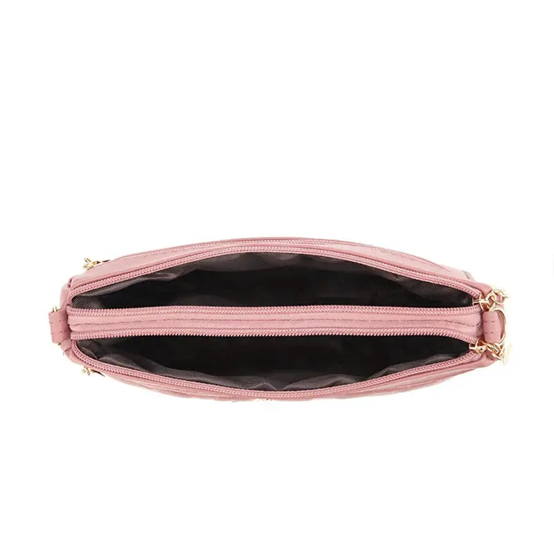 Pink PU leather crossbody bag with dual zipper top and gold hardware