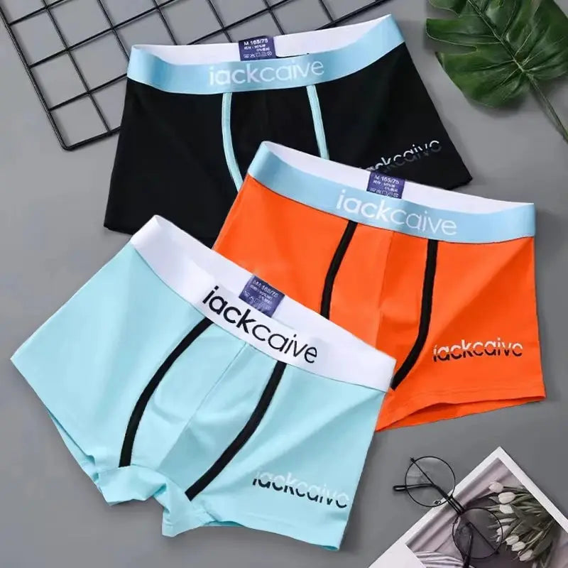 3-pack cotton men's boxer shorts in black, orange, and light blue with blue waistbands