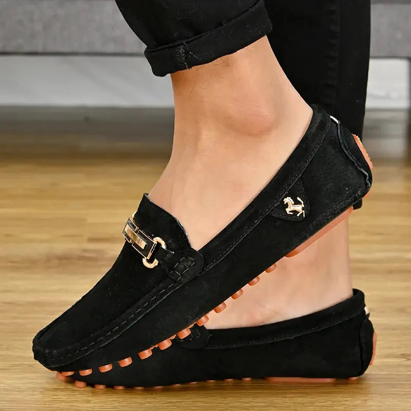 YRZL men's black suede loafers by Simples Market with buckle detail and orange outsole nubs