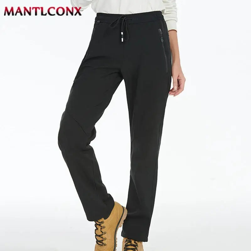 Men's jogger pants by MANTLCONX, breathable quick-dry, black with zip pockets and drawstring waist