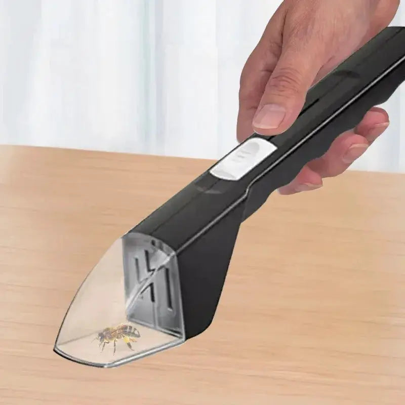 Simples Market handheld insect catcher with black plastic body and transparent trapping cone, shown catching a bee.