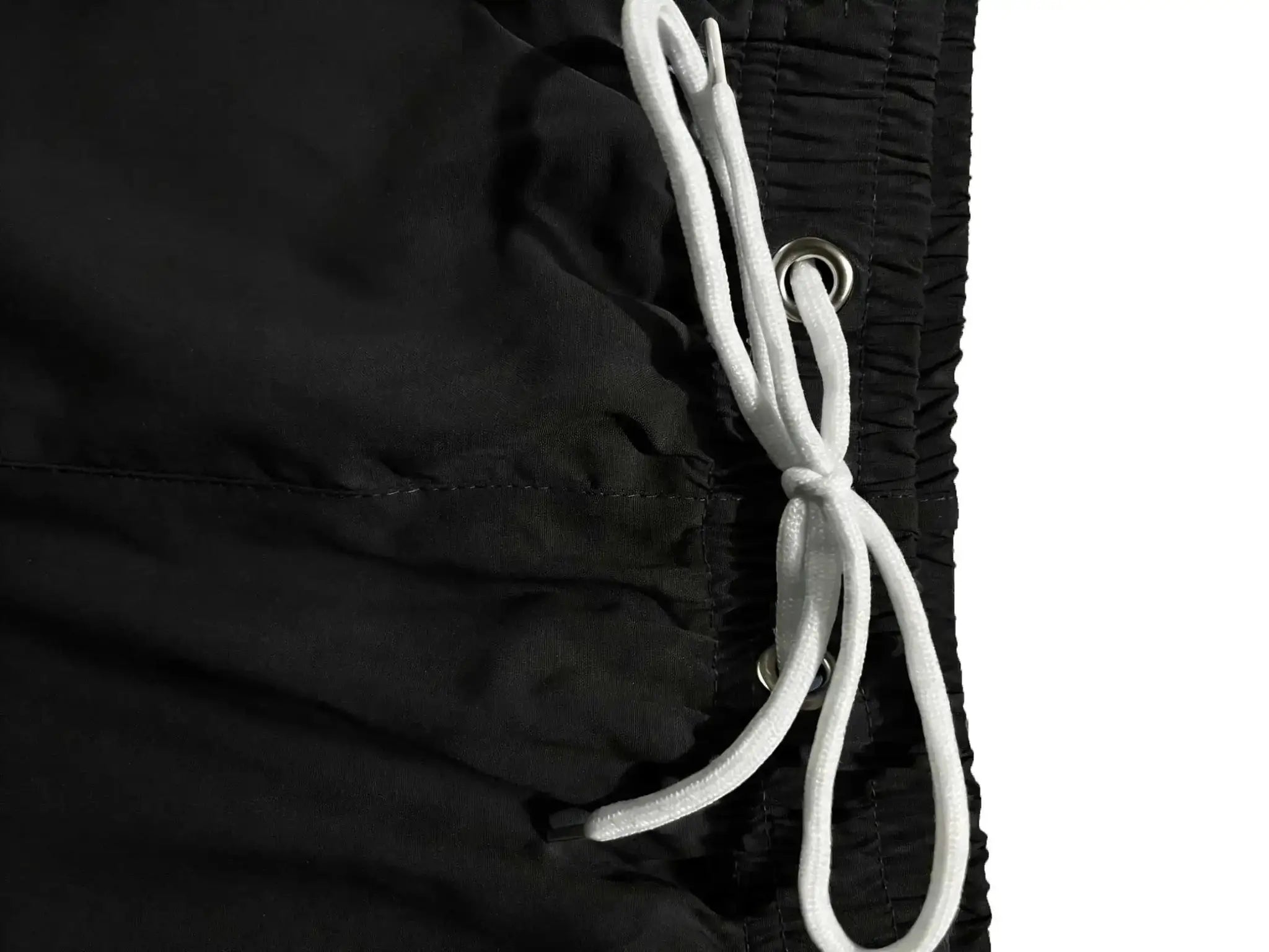 Men's black swim trunks with white drawstrings and elastic waist