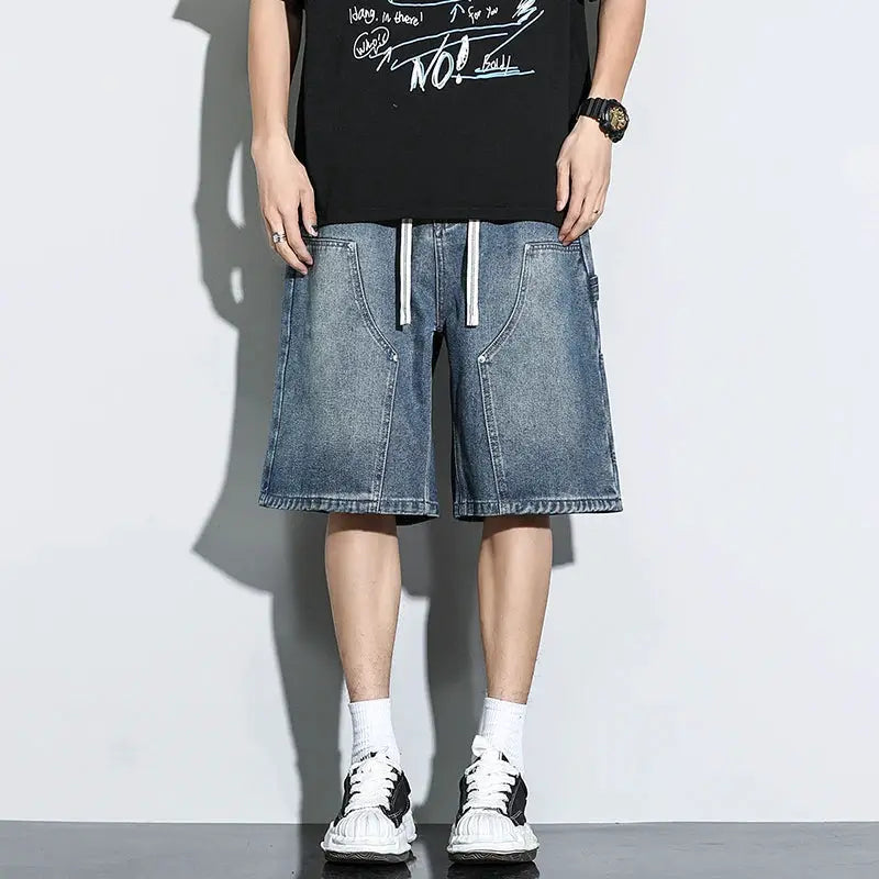 Men's blue denim knee-length shorts with a loose fit.