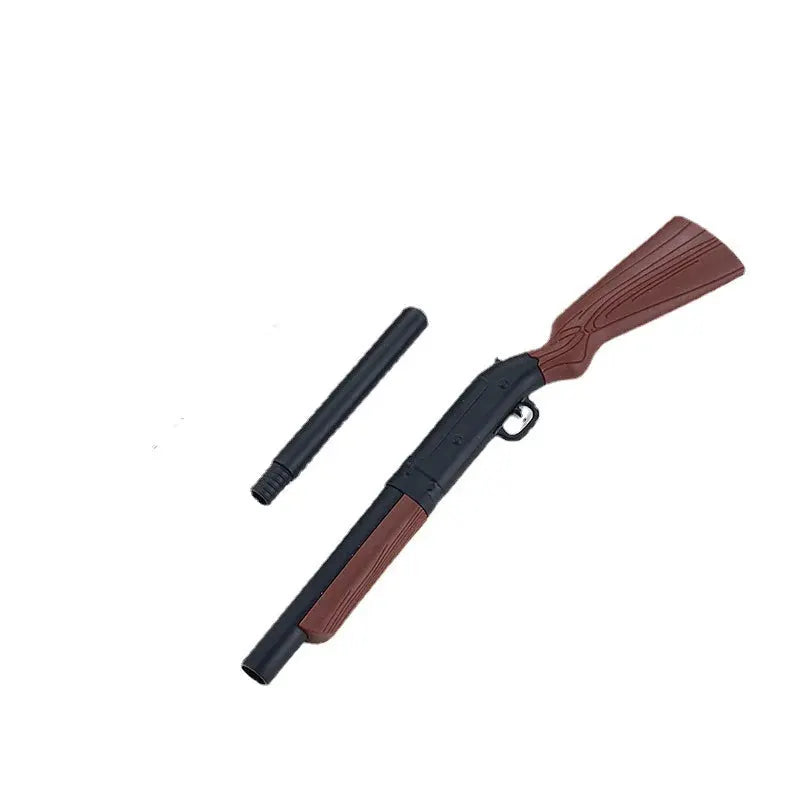 Gun-shaped ballpoint pen by Simples Market, brown grip with black barrel and detachable cap