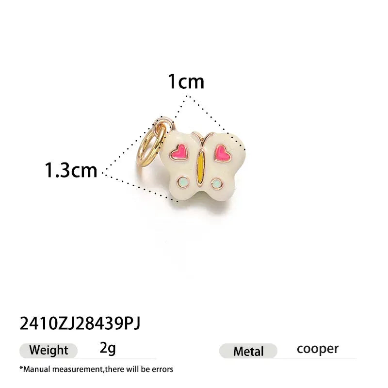 Butterfly pendant single hoop earring by Simples Market; white charm with pink heart wings and gold hoop, about 1 cm.