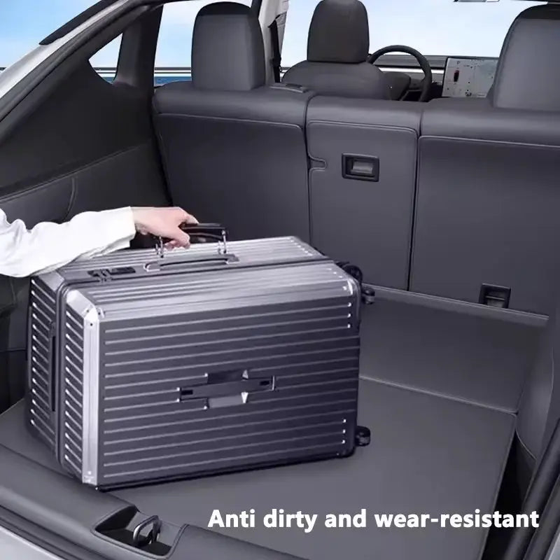 Simples Market Juniper trunk mat for Tesla Model Y; full-coverage cargo liner with side guards and 1 silver suitcase