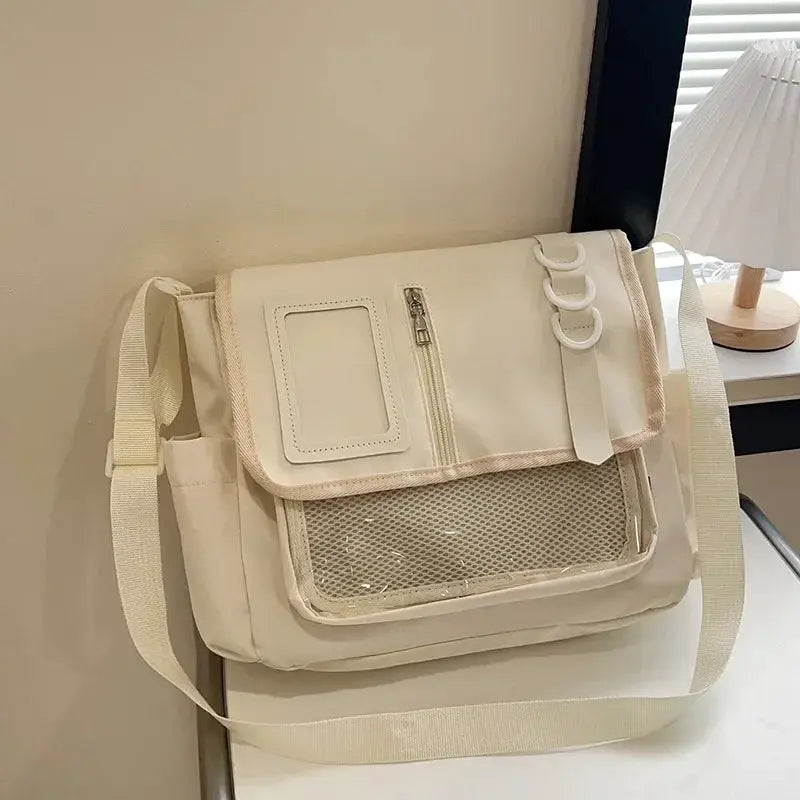Itabag crossbody bag in beige with clear front window pocket and front mesh pocket, adjustable strap