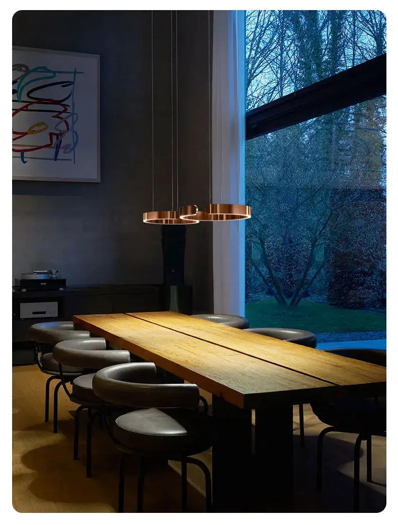 Nordic ring LED pendant lamp, black and gold, dimmable two-ring chandelier over wooden dining table