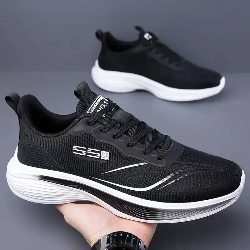 Pair of breathable mesh men's casual sneakers, black with white sole.