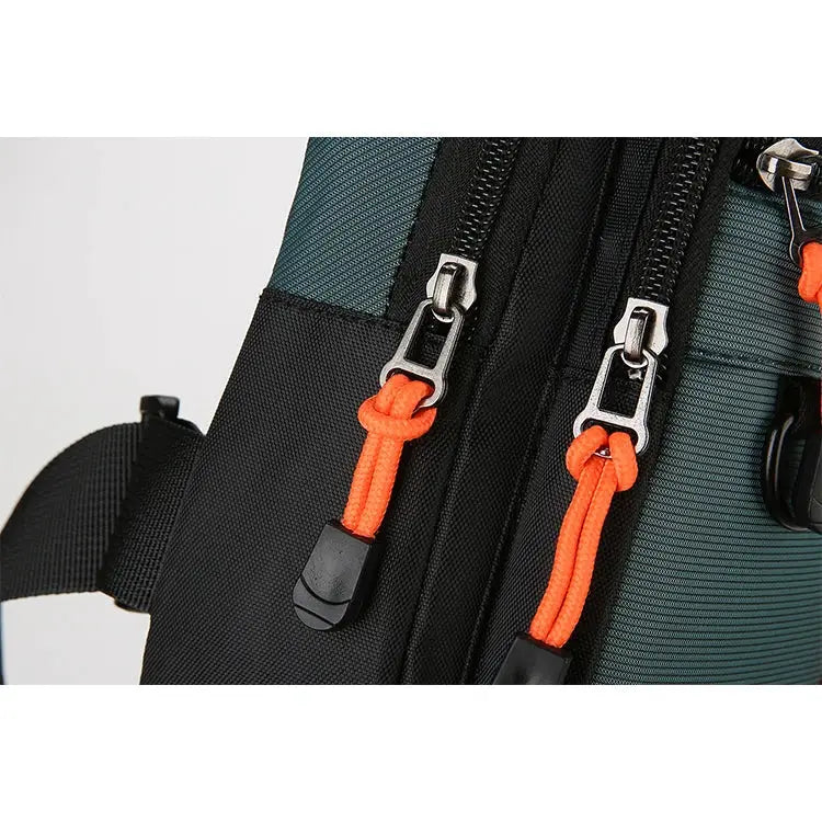 Men's outdoor hiking shoulder bag with teal/black fabric and dual zippers featuring orange paracord pulls