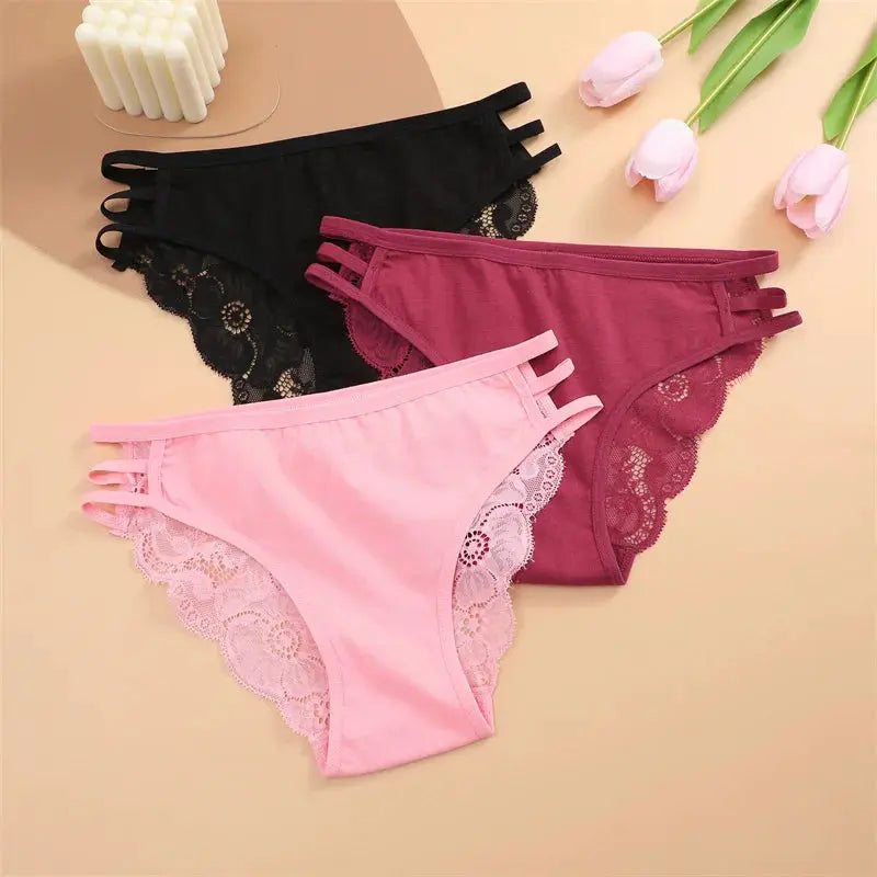 3pc set of women's lace low-rise briefs in black, burgundy, and pink with floral lace trim and triple-strap sides