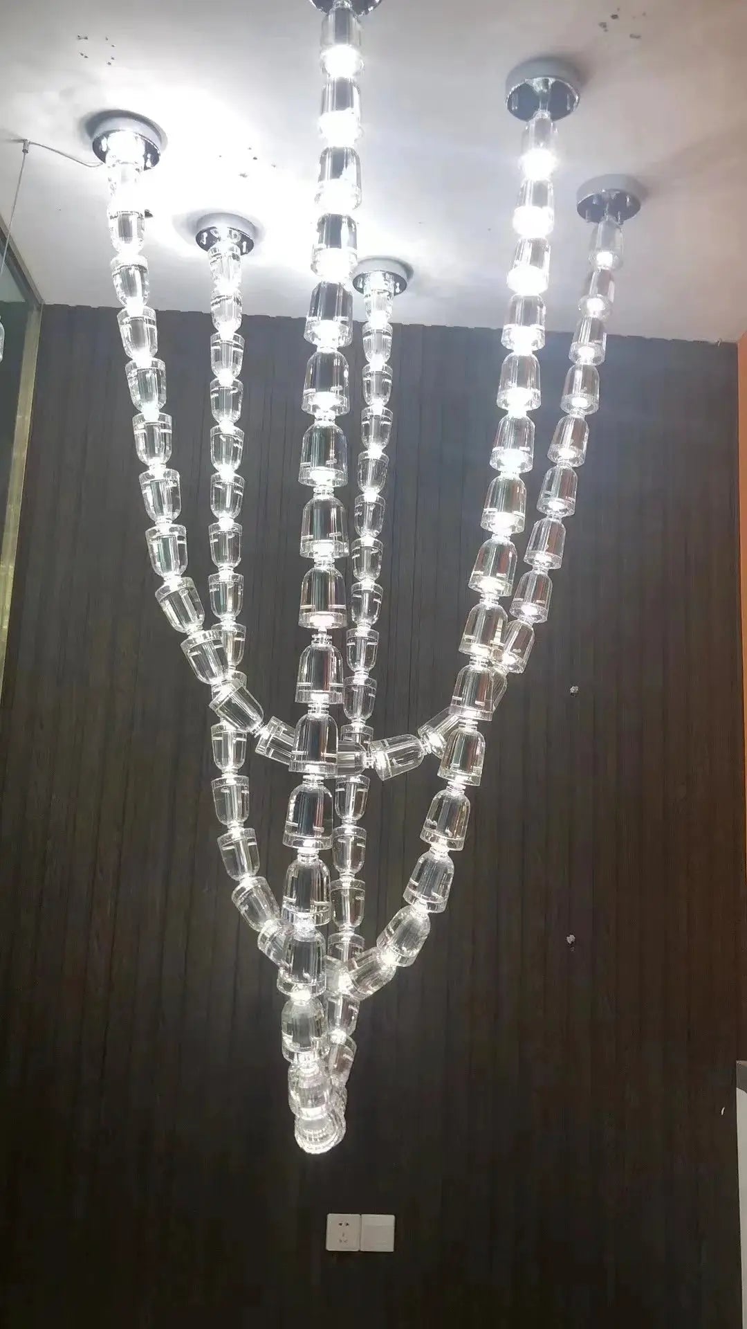 Necklace chandelier by Simples Market with multiple crystal acrylic bead strands, adjustable ceiling light