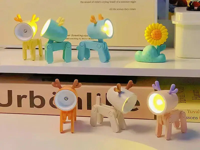 Mini LED night light set of 7 folding desk lamps in cartoon deer shapes; yellow teal orange and purple for kids' rooms.