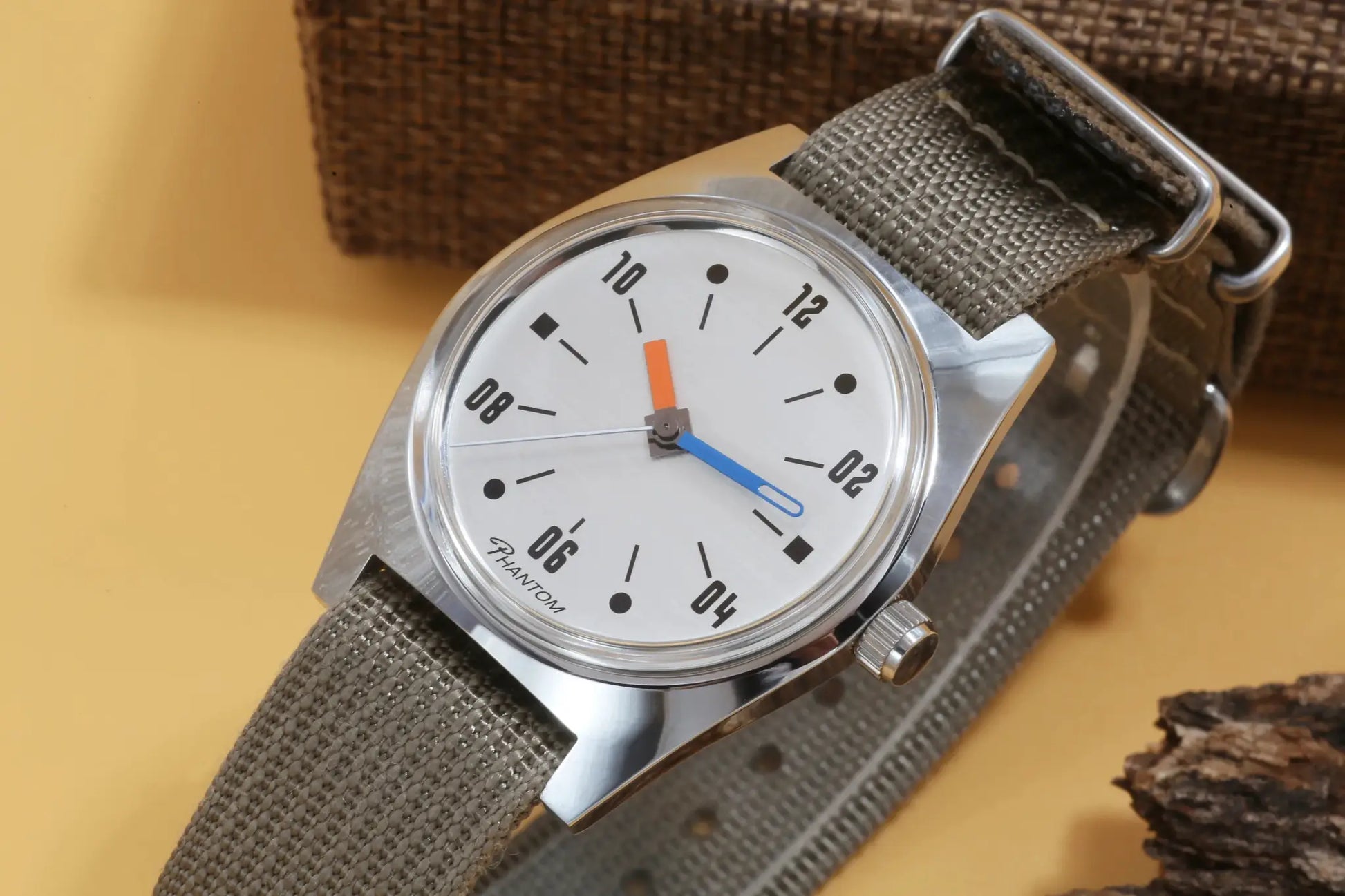 Hand-wind mechanical watch, 36mm, white dial with black numerals, stainless steel case, gray fabric strap