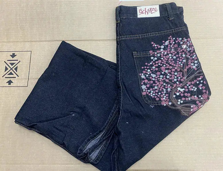 Vintage low-waist baggy jeans by Simples Market with cherry blossom embroidery on the back pocket in dark denim.