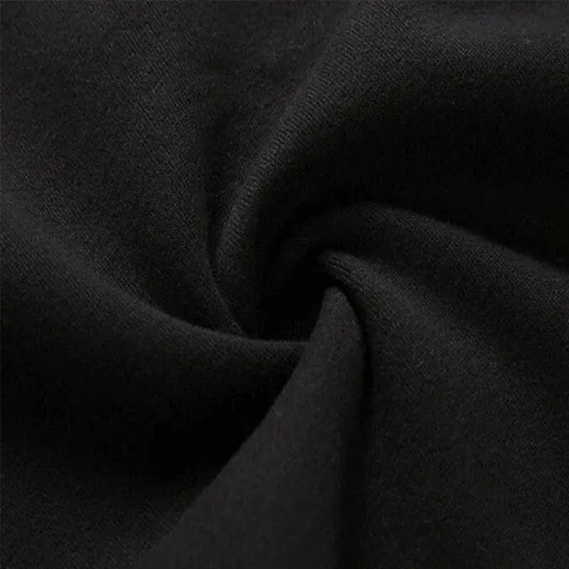 Men's black sweatpants fabric close-up showing smooth knit texture