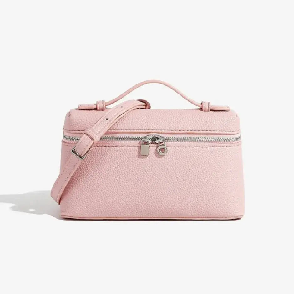 Pink lychee grain pebbled mini lunch-box bag with top handle and detachable crossbody strap.