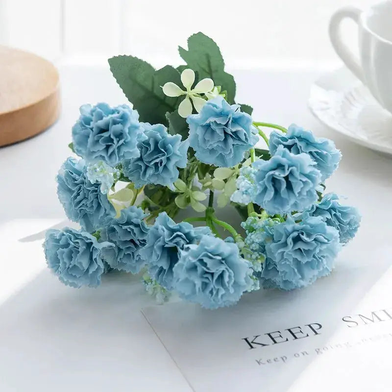Blue artificial carnation bouquet with green leaves and 15 flower heads