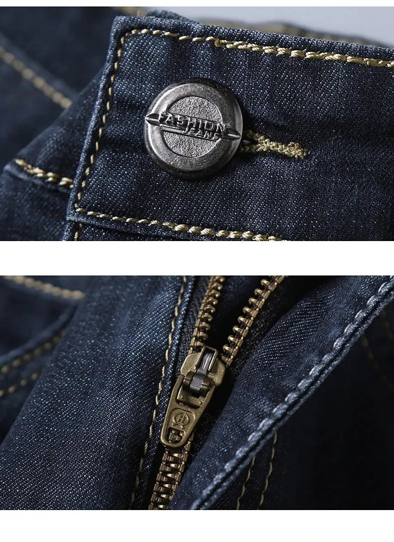 Men's dark blue denim jeans with brass zipper and metal button detailing
