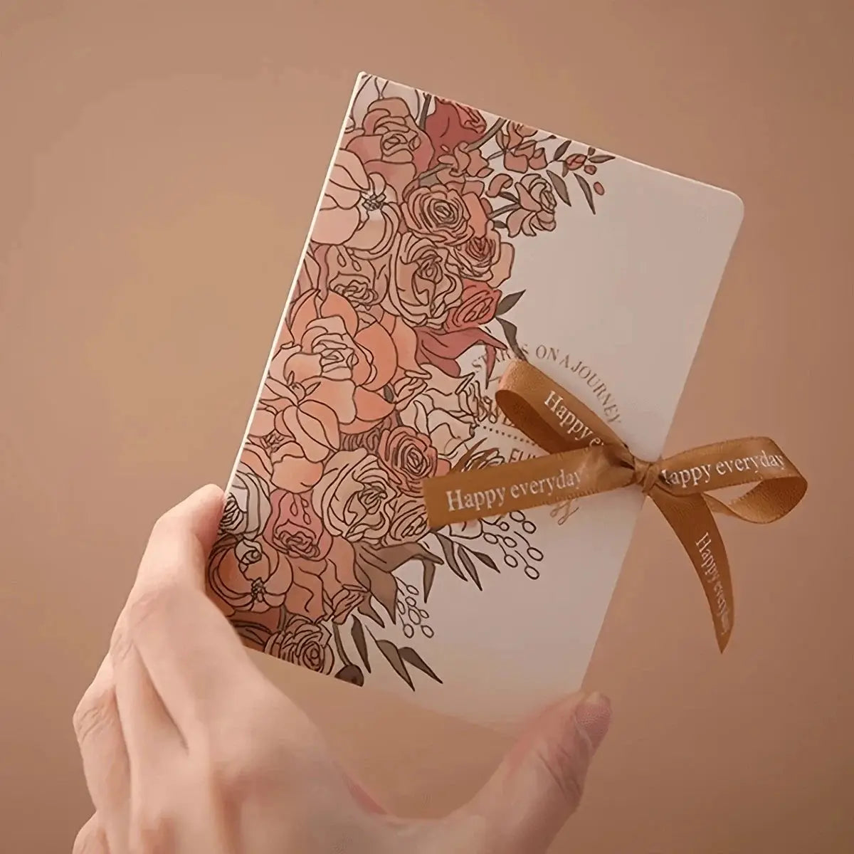 5Pcs book-shaped gift box set with rose floral print, paperboard body, and brown ribbon