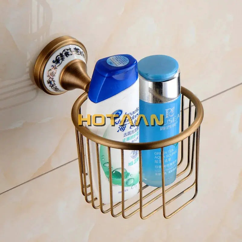 Antique brushed brass bathroom set: wall-mounted wire rack with porcelain accents holding shampoo bottles