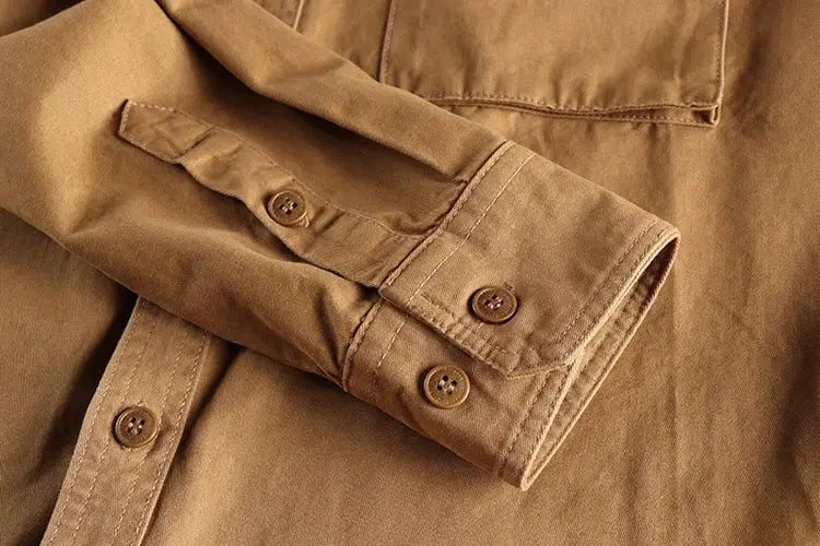 Khaki work shirt by Simples Market with button cuffs, chest pocket and loose fit, retro wash
