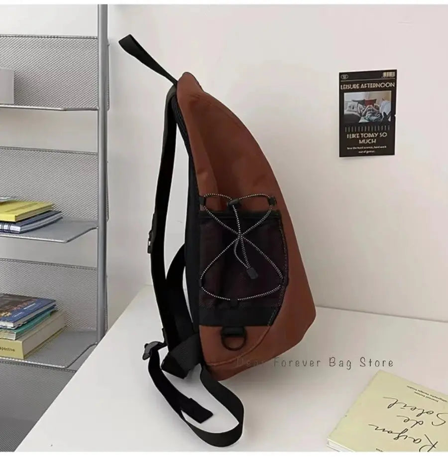 Y2K portable light nylon crossbody bag, brown with black front pocket and bungee cord