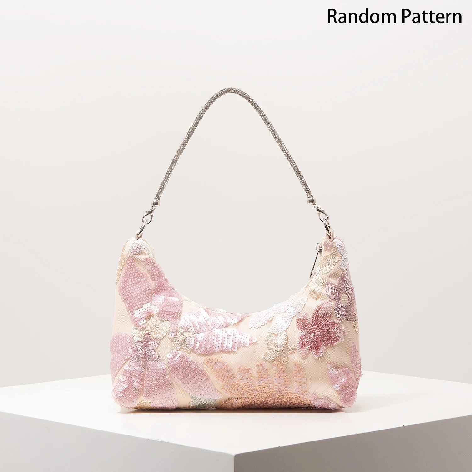 Shoulder bag with pink floral sequin embroidery and a glittery metallic strap