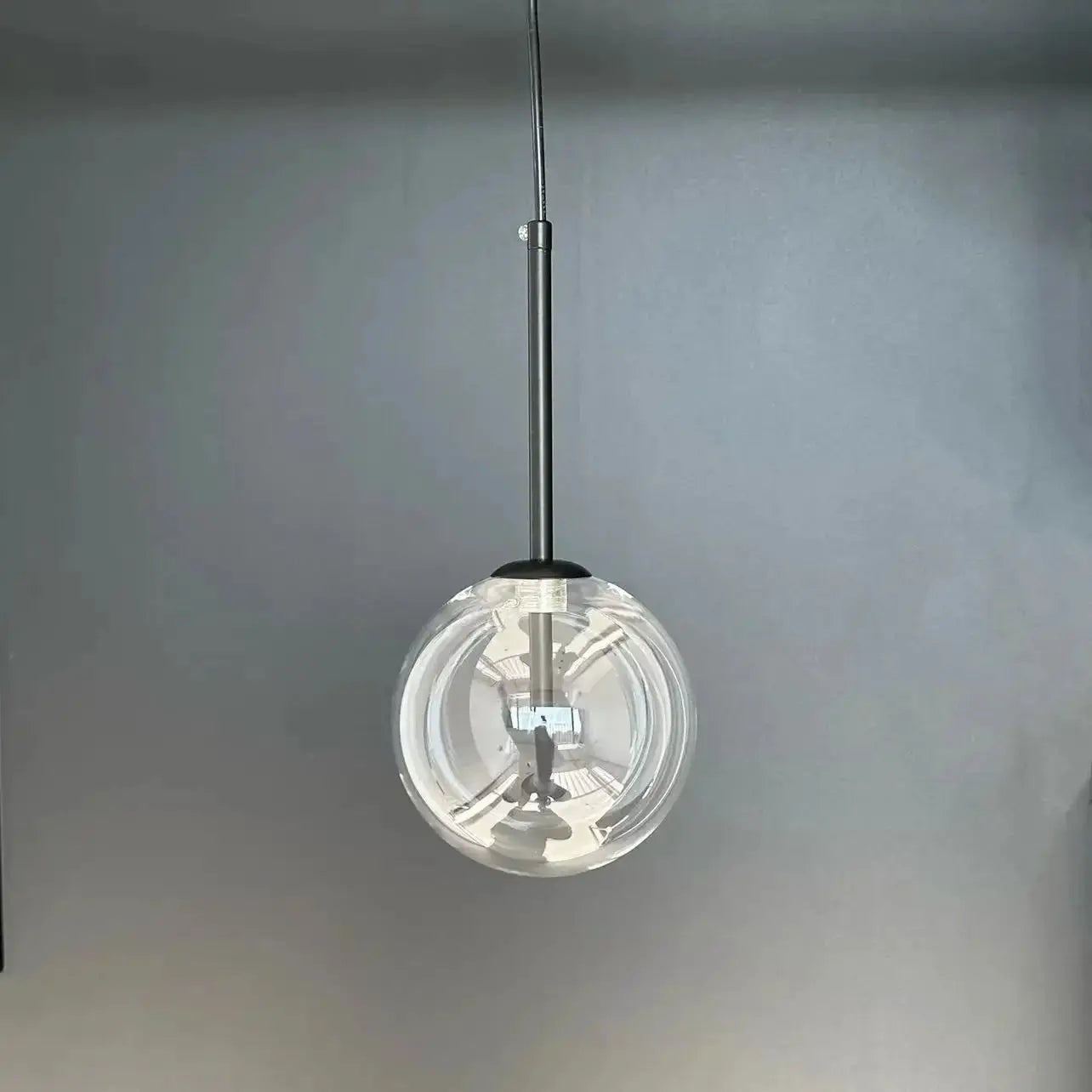 LED glass ball pendant lamp with clear globe and black suspension cord