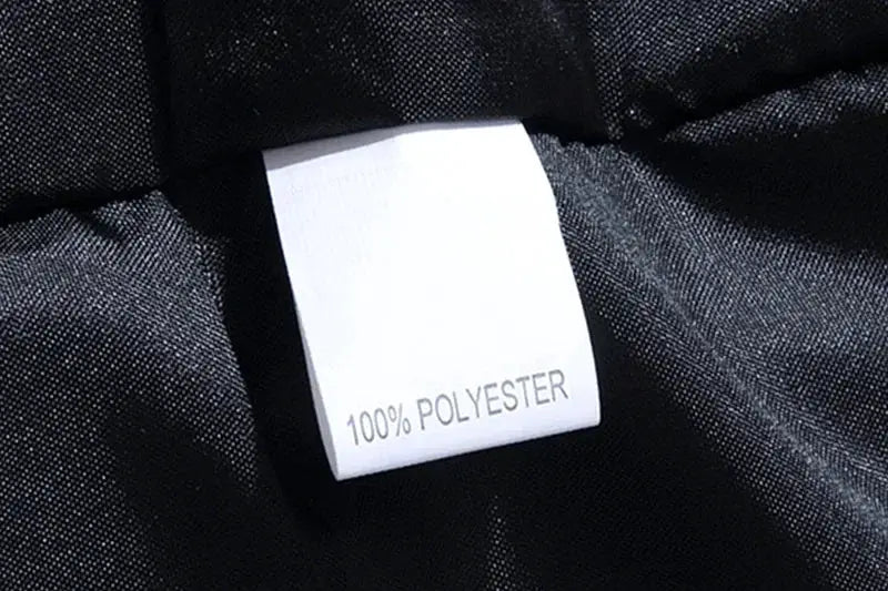 Jacket interior tag on black fabric reads 100% polyester
