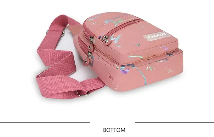 Chest bag crossbody small sling backpack in pink with graphic prints.