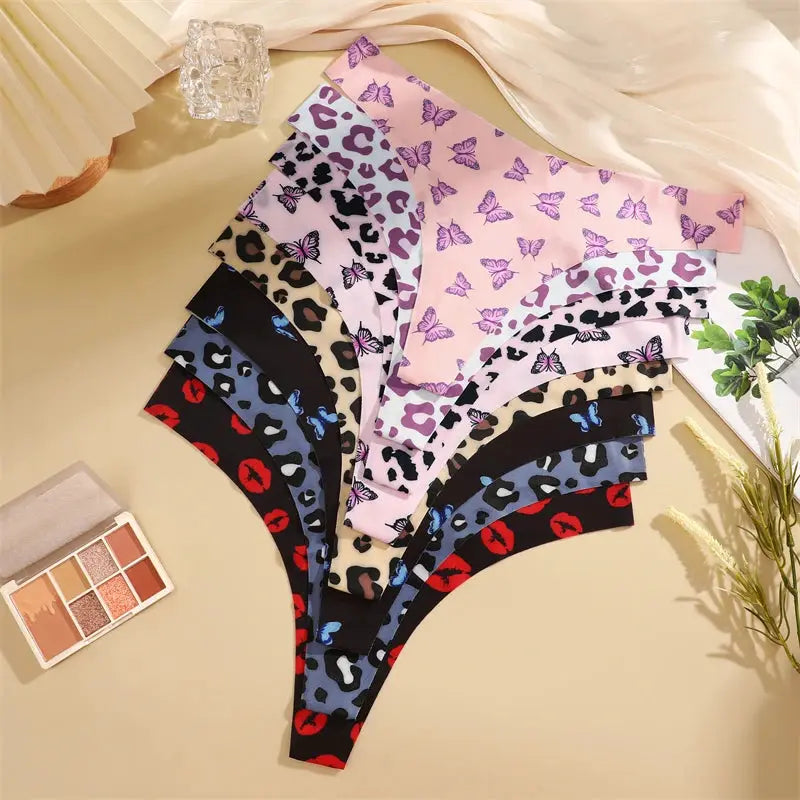 FINETOO 4-pack women's seamless thongs by Simples Market in leopard and butterfly prints, assorted colors