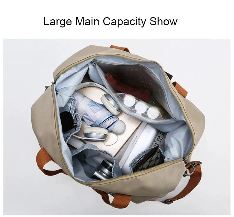 Beige travel gym bag with brown straps, open to reveal organized interior with headphones and assorted items.