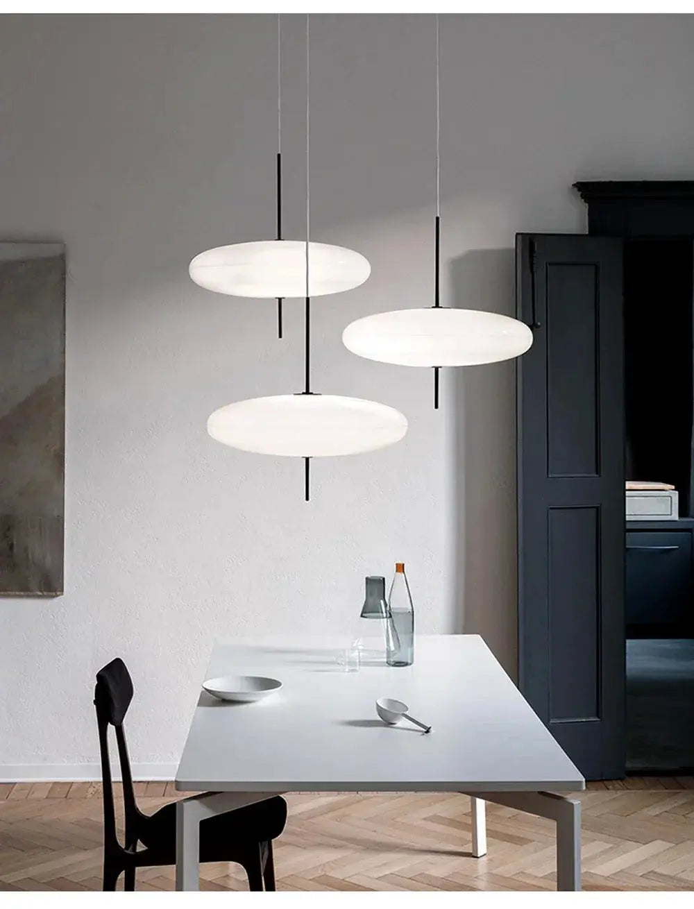 Nordic LED pendant lights, three white flying-saucer lamps with black suspensions