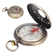 Simples Market brass pocket compass with ornate filigree lid and red needle; portable navigation accessory