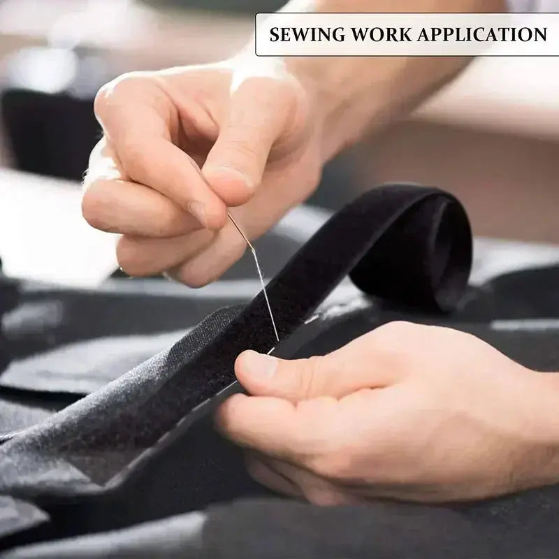 Cable organizer wire winder tape being stitched on a black fabric strap