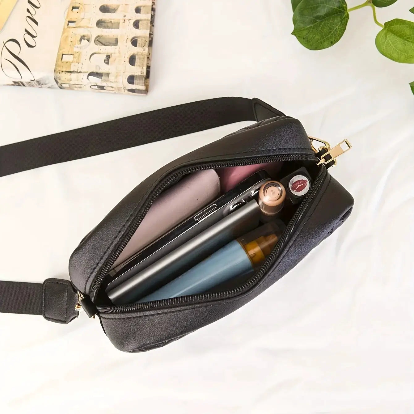 Minimalist black quilted PU crossbody bag wallet by Simples Market; mini handbag with strap holding phone and cosmetics.