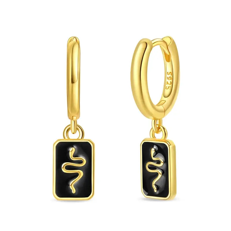 Pair of gold hoop earrings with black enamel rectangular pendants and gold squiggle motif