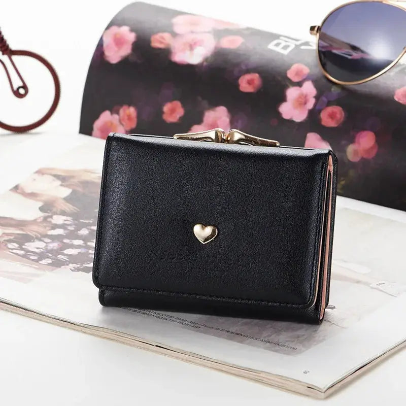 Mini black wallet with gold heart clasp by Simples Market